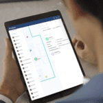 Man looking at tablet displaying RTLS data.