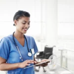 Nurse working in a hospital on an ipad.